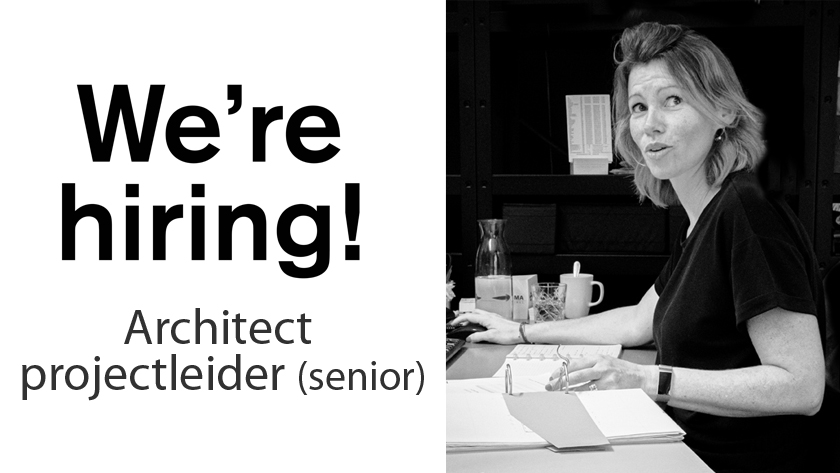 We're hiring! Architect projectleader (senior). Photo of a woman at a desk with papers.